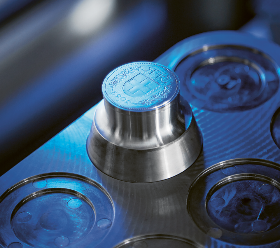 Brilliant uncirculated coins now made using a laser brush